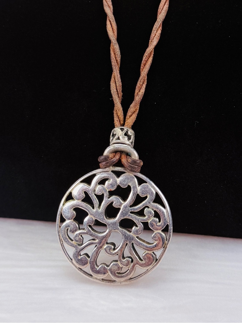 Beautiful weighted hallowed Silvertone Bohemian pendant with brown necklace